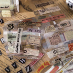 Close-up of ephemera PET tape featuring faded receipts vintage tickets and handwritten labels on clear backing