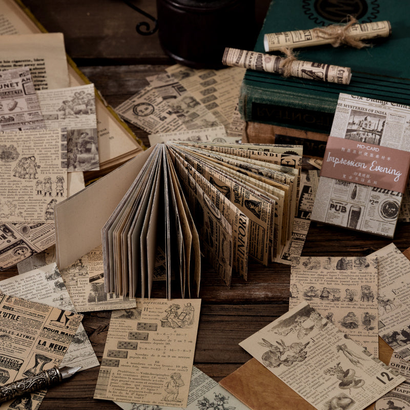 Vintage mini papers fanned out on dark wood