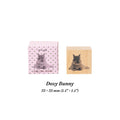 Dozy Bunny beech wood journal stamp with stamped impression of a daydreaming rabbit