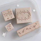 Four vintage star beech wood rubber stamps with natural wood grain and carved rubber constellation surfaces, pre-cut celestial stamps for planner spreads