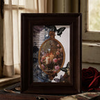 Framed butterfly art with washi tape on a desk near window