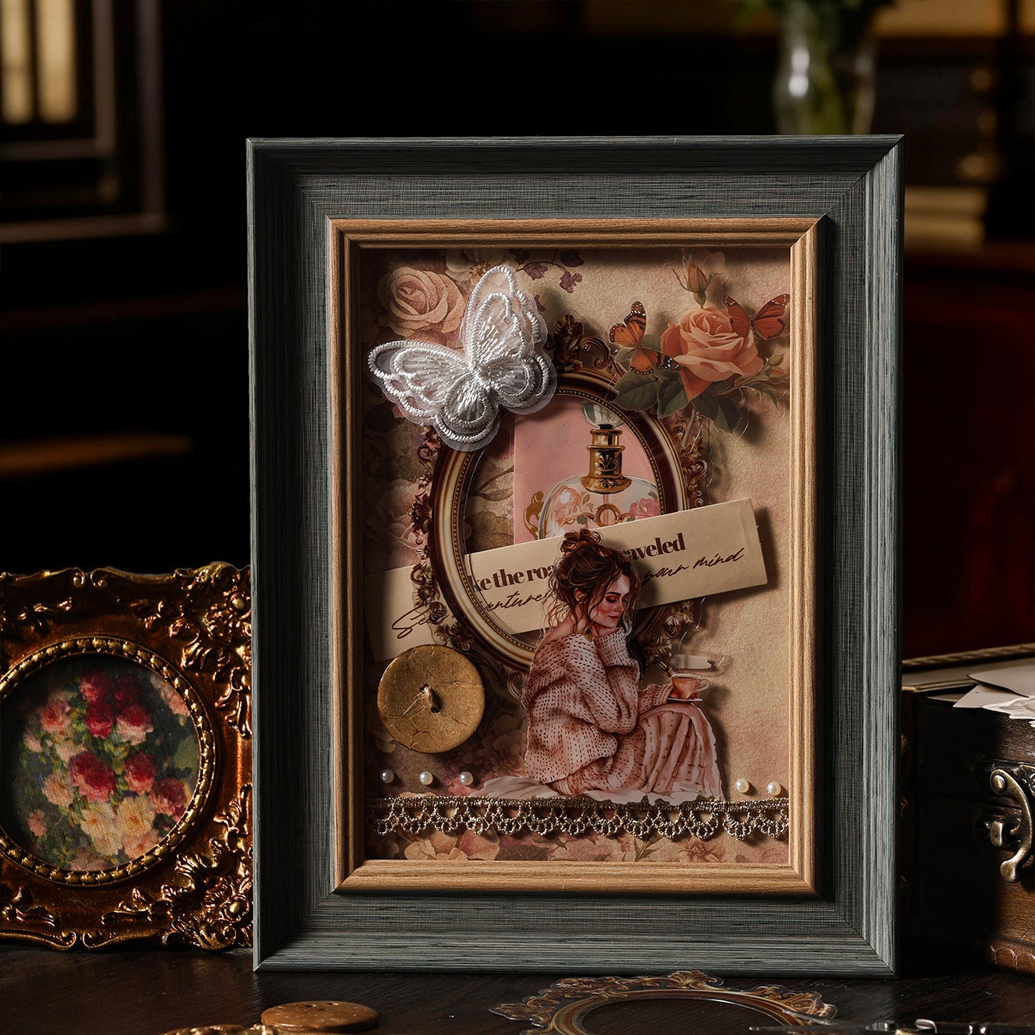 Framed vintage collage art made with the paper kit - reading girl sticker, rose ephemera, white butterfly, pearl accents and lace border