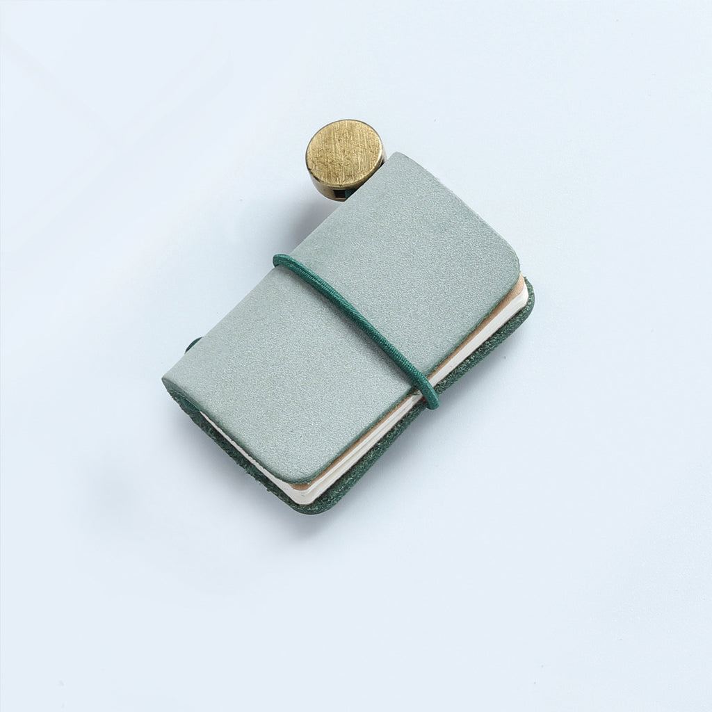 Green frosted wax leather mini traveler's notebook charm with elastic band and vintage metal clasp