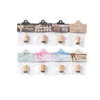 Full set of 8 chocolate stamps lined up in two rows with wooden handles