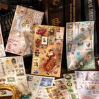 French garden tea party sticker sheets laid out on a dark desk