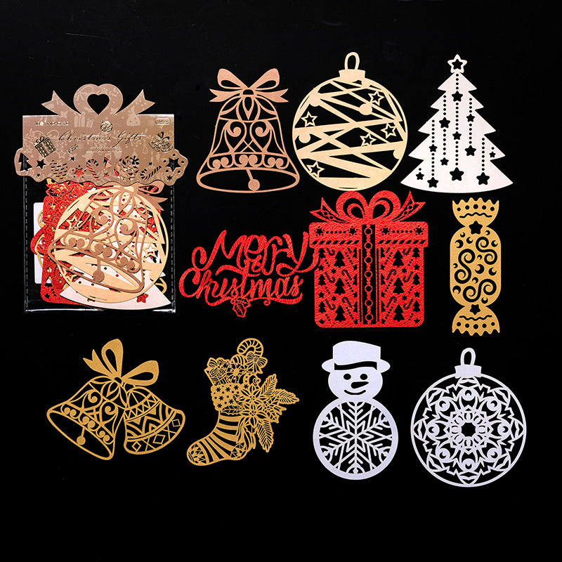 Gold red and silver laser cut Christmas bells and ornaments on black