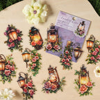 Gold-stamped lantern stickers scattered among white flowers