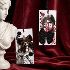 Gothic bow sticker cards arranged on red velvet with classical bust