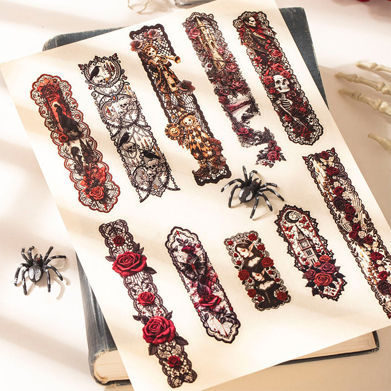 Gothic lace stickers arranged in an open journal with spider decorations