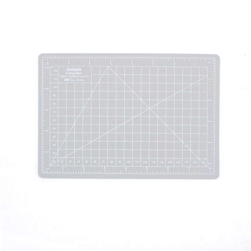 Gray A5 self-healing cutting mat with printed grid and angle guides