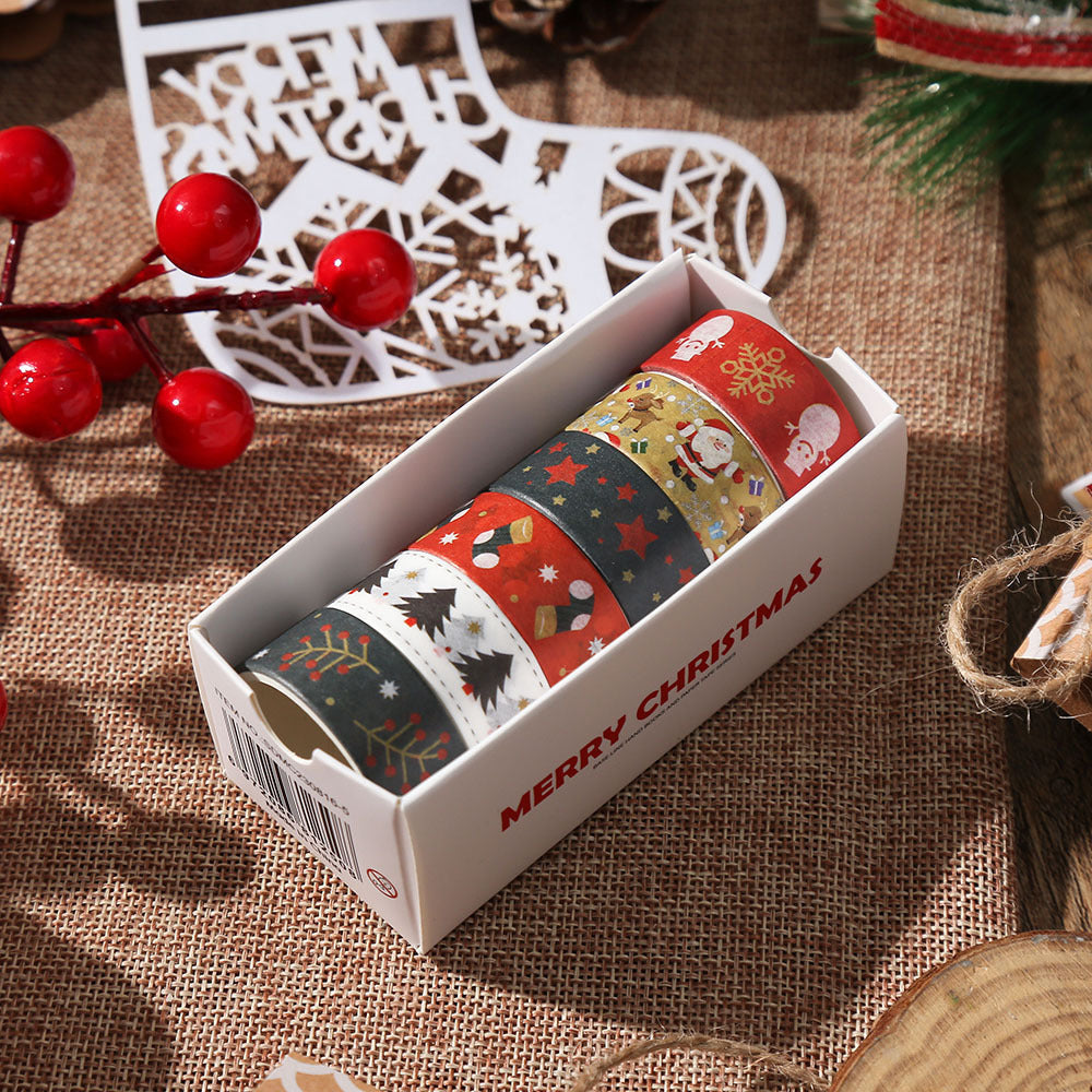 Green and red Christmas washi tape rolls in box