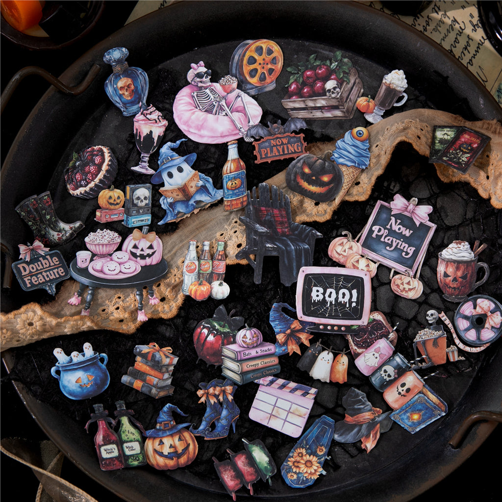 Vintage Halloween kraft paper stickers scattered on a dark table