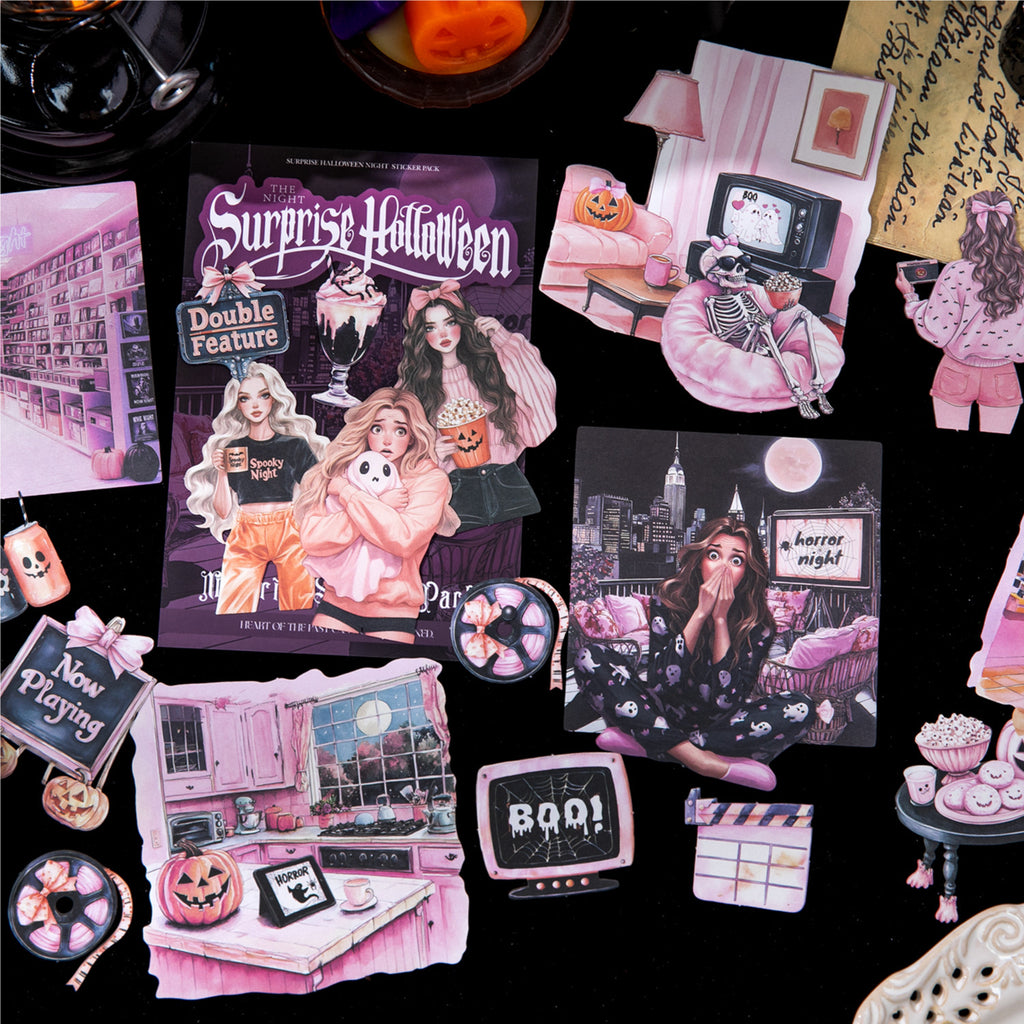 Halloween stickers arranged in a pink and purple journal spread