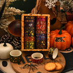 Halloween washi tape 14-roll gift set styled with pumpkins, spooky cookies, and candlelight