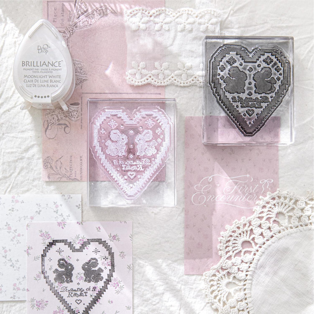 	Handmade lace acrylic clear stamp with pink bow design on vintage lace and doily background
