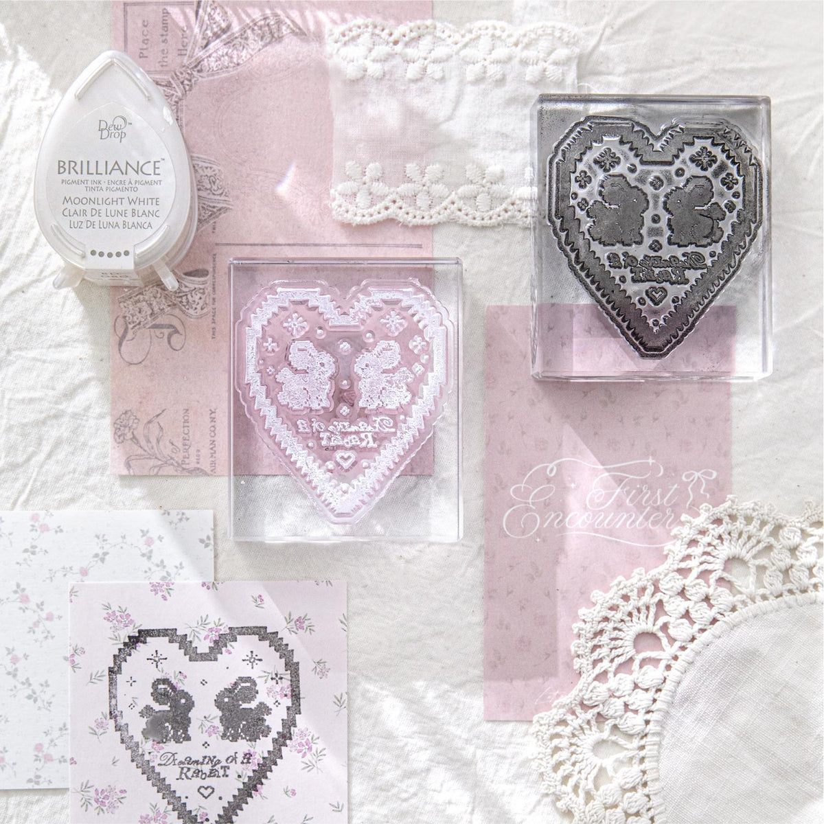 	Handmade lace acrylic clear stamp with pink bow design on vintage lace and doily background