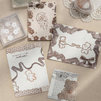 Stamped sample papers showing bunny heart and little lamp lace motifs in brown ink