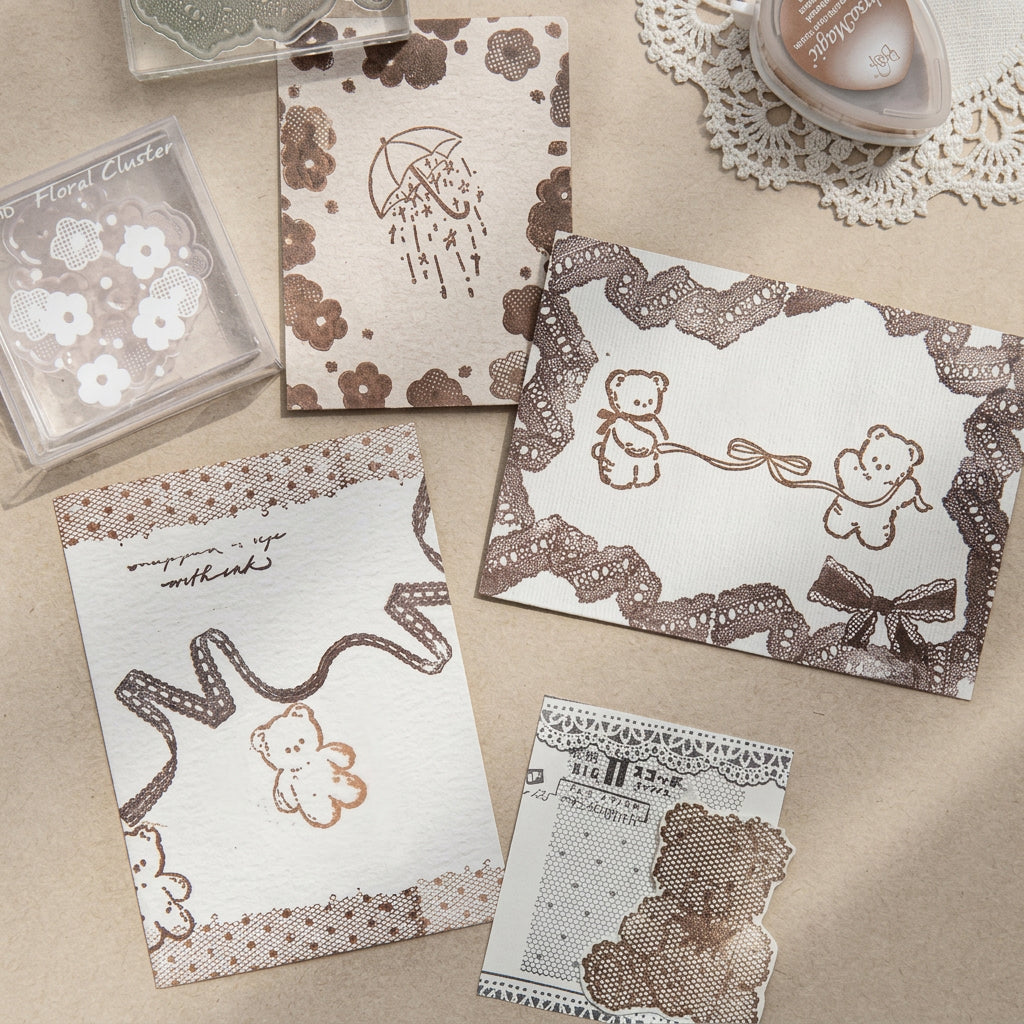 Stamped sample papers showing bunny heart and little lamp lace motifs in brown ink