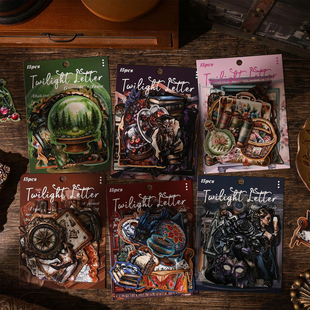 Six hard card sticker packs displayed on a dark vintage surface