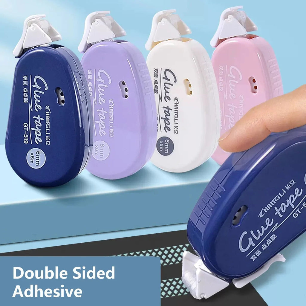 	Four glue tape rollers in navy, lavender, white and pink, one in hand applying adhesive dots