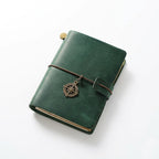Hunter Green premium leather EDC pocket notebook, showcasing natural leather patina and a classic elastic band binding.