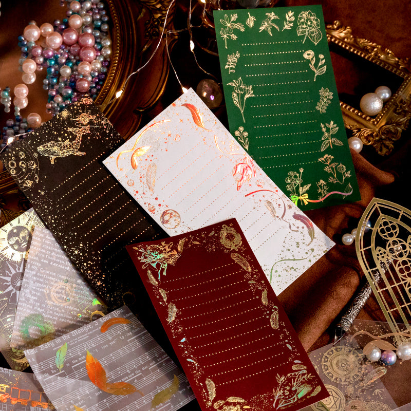 Vintage junk journal spread decorated with gold foil mushroom and butterfly stickers on coffee dyed paper