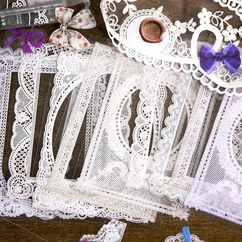 Hands holding translucent lace sticker pieces with scalloped edges