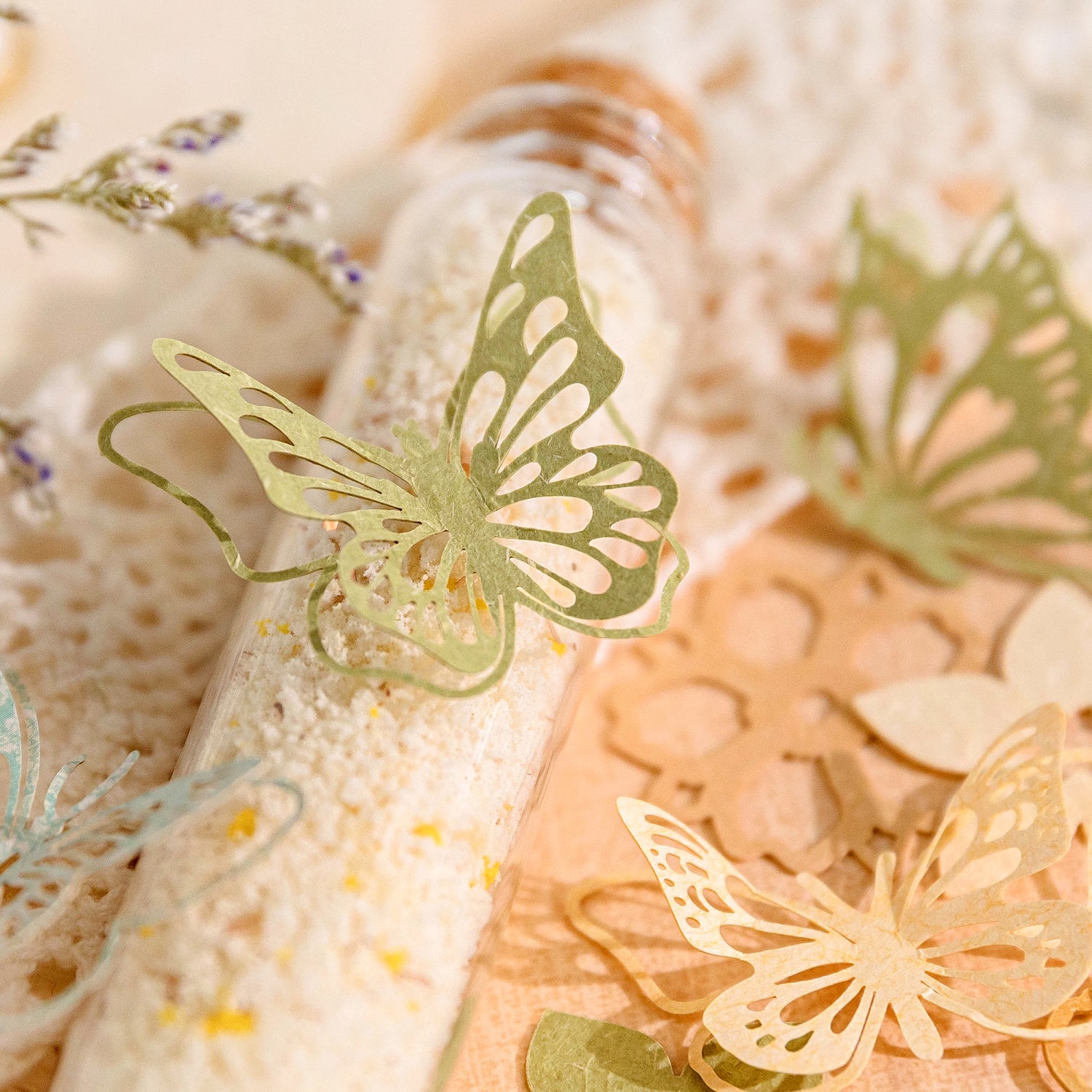 Vintage garden themed paper pack showing detailed floral patterns and butterflies