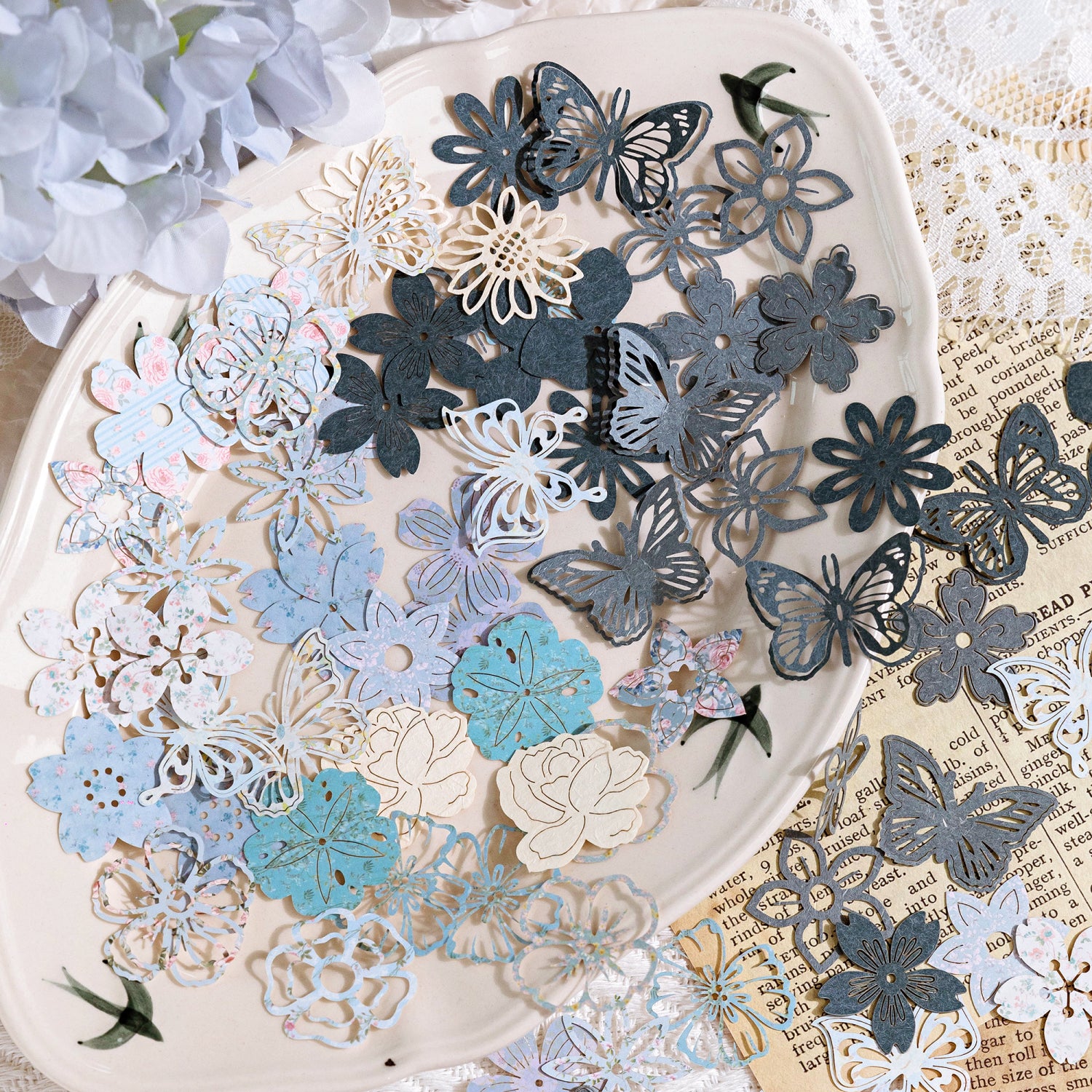 Delicate butterfly and floral die-cut paper pieces for planner decoration