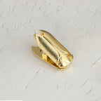 Single Luminous Gold vintage cicada metal journal clip. A heavy-duty aesthetic desk accessory perfect for holding chunky junk journals flat.