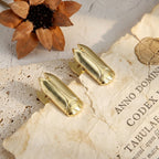 Set of 2 Luminous Gold vintage cicada metal binder clips holding aged French script paper. Ideal Dark Academia supplies for flat-lay photography.