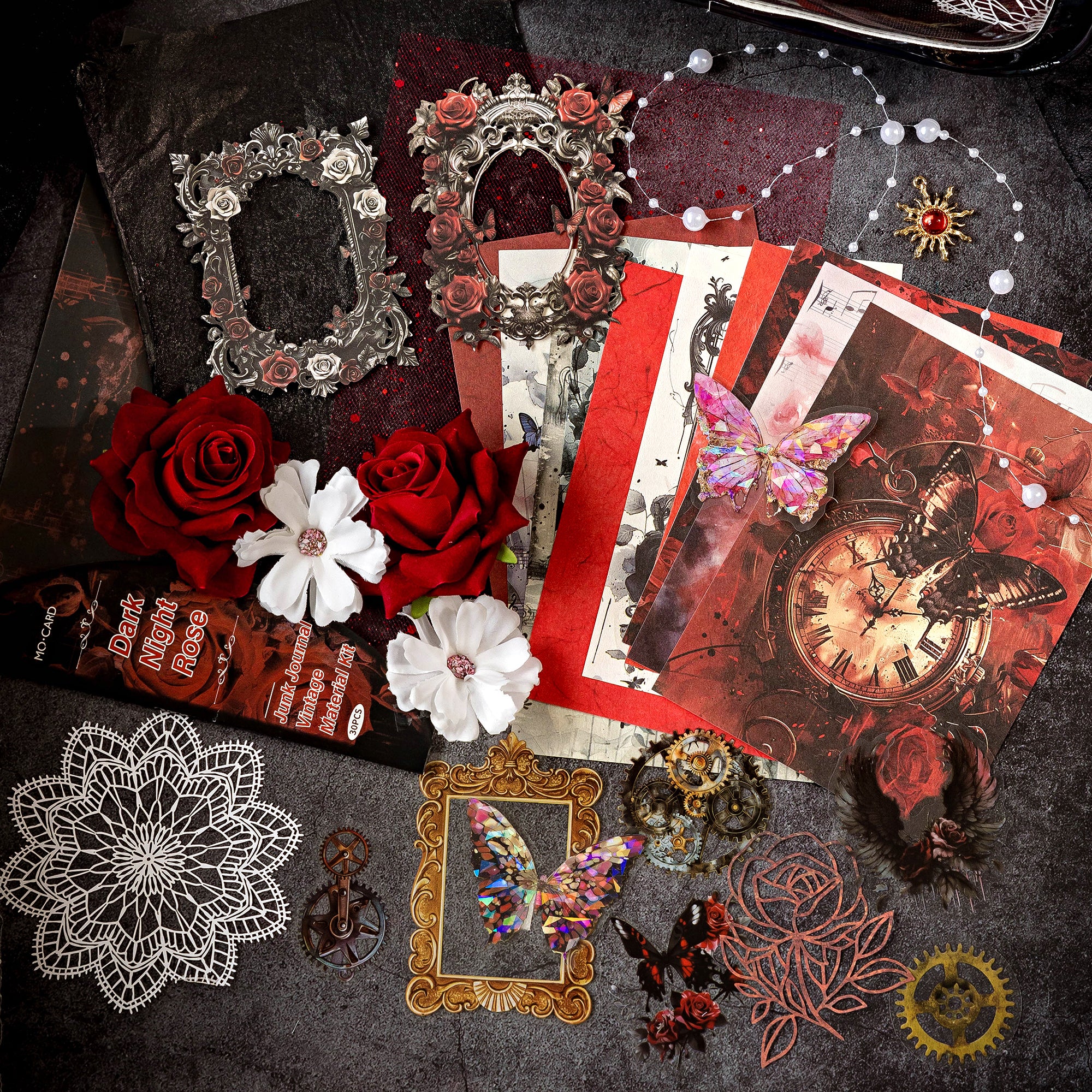 Variant image of the Midnight Rose style Premium Mixed Media Junk Journal Kit in its deep red and black packaging. Shows the 30 gothic-inspired pieces including baroque laser-cut frames, holographic PET dark red roses and butterfly elements, and textured background papers.