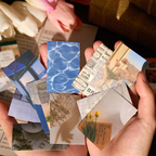 Pocket-sized vintage sticker book showing compact portable design for journaling