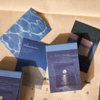 Open mini vintage sticker book displaying floral sticker sheets and designs