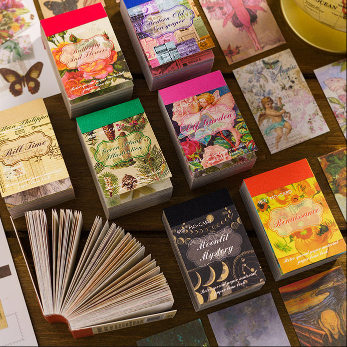 Eight mini vintage paper booklets with cloth spines fanned open