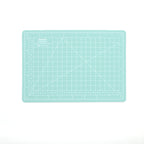 Mint green A5 self-healing cutting mat with white measurement grid