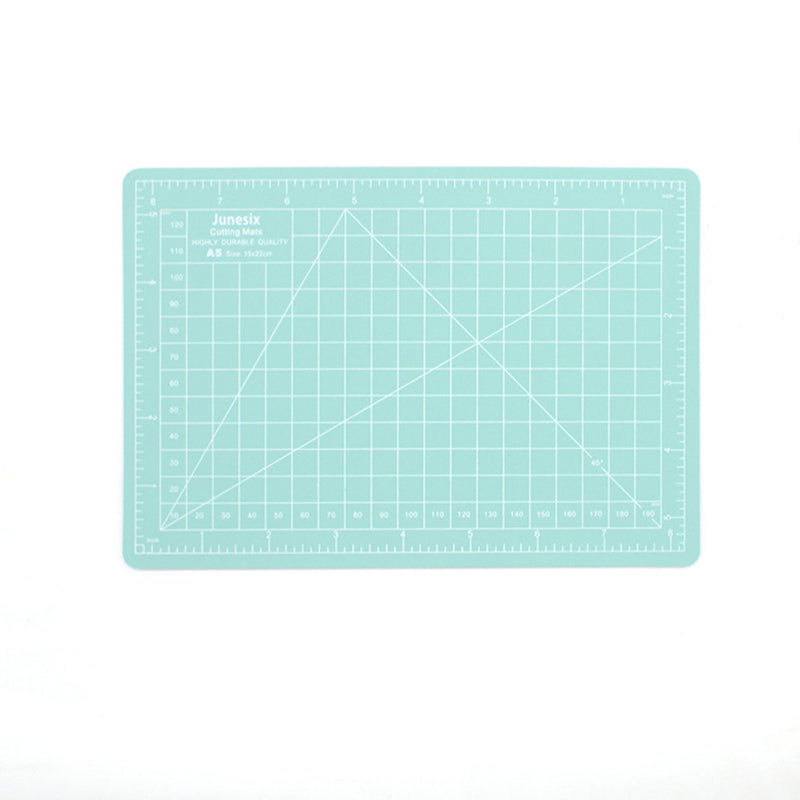 Mint green A5 self-healing cutting mat with white measurement grid