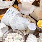 Misty blue handwriting practice washi tape with mountain doodles and letter drills on candlelit desk with pearls