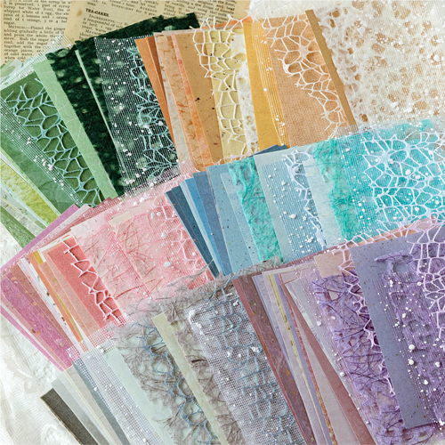 Close-up of textured mesh and lace paper materials