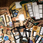 Vintage ephemera kit contents including film strips, lace frames, and retro stickers for journaling