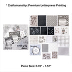 Variant image for the Monochrome Archive style of the vintage letterpress faux postage stamp ephemera pack. Showcases 20 detailed die-cut stamps in grey and monochrome hues featuring vintage keys, houses, and starry motifs, letterpress printed on premium textured specialty papers.