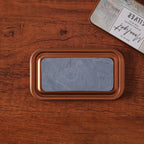 	Vintage iron box ink pad in Frost White open on wood, white moon lid beside