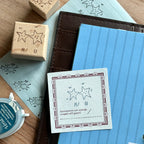 Multiple star constellation beech wood stamps with carved rubber impressions showing celestial corner borders and star fragments, pre-cut designs for junk journal decoration
