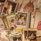 Vintage frames and sticker sheets displayed on an easel shelf