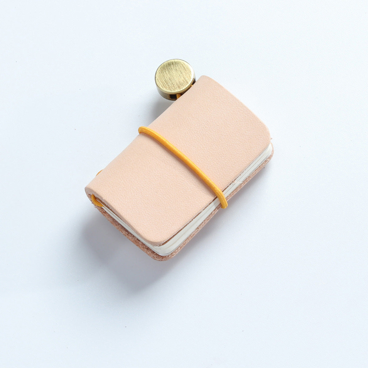 Natural tan vegetable tanned leather mini traveler's notebook charm with elastic band and vintage metal clasp