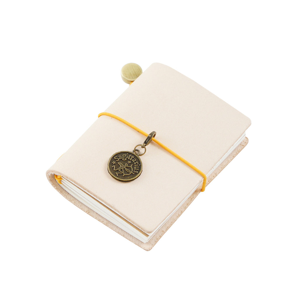 Natural undyed vegetable tanned genuine leather mini pocket notebook that develops a unique patina over time