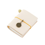 Natural undyed vegetable tanned genuine leather mini pocket notebook that develops a unique patina over time