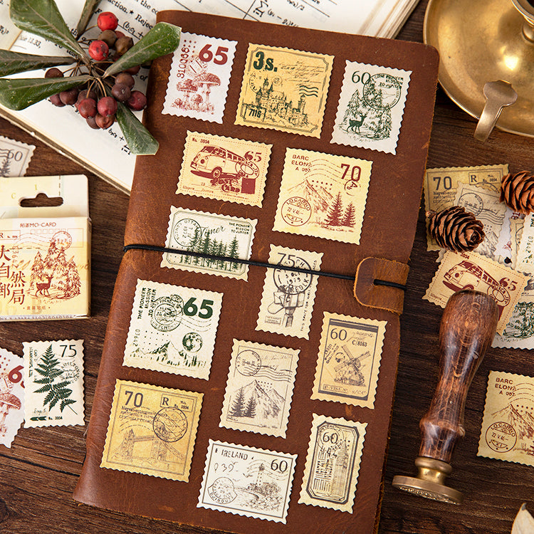 Close-up of vintage stamp sticker cube showing nature-themed postal stamp designs