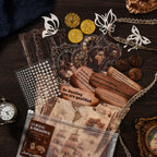 Vintage collage kit contents flat lay - antique frame and clock PET stickers, pearl sticker sheet, quote paper scrolls, lace trim and wood buttons