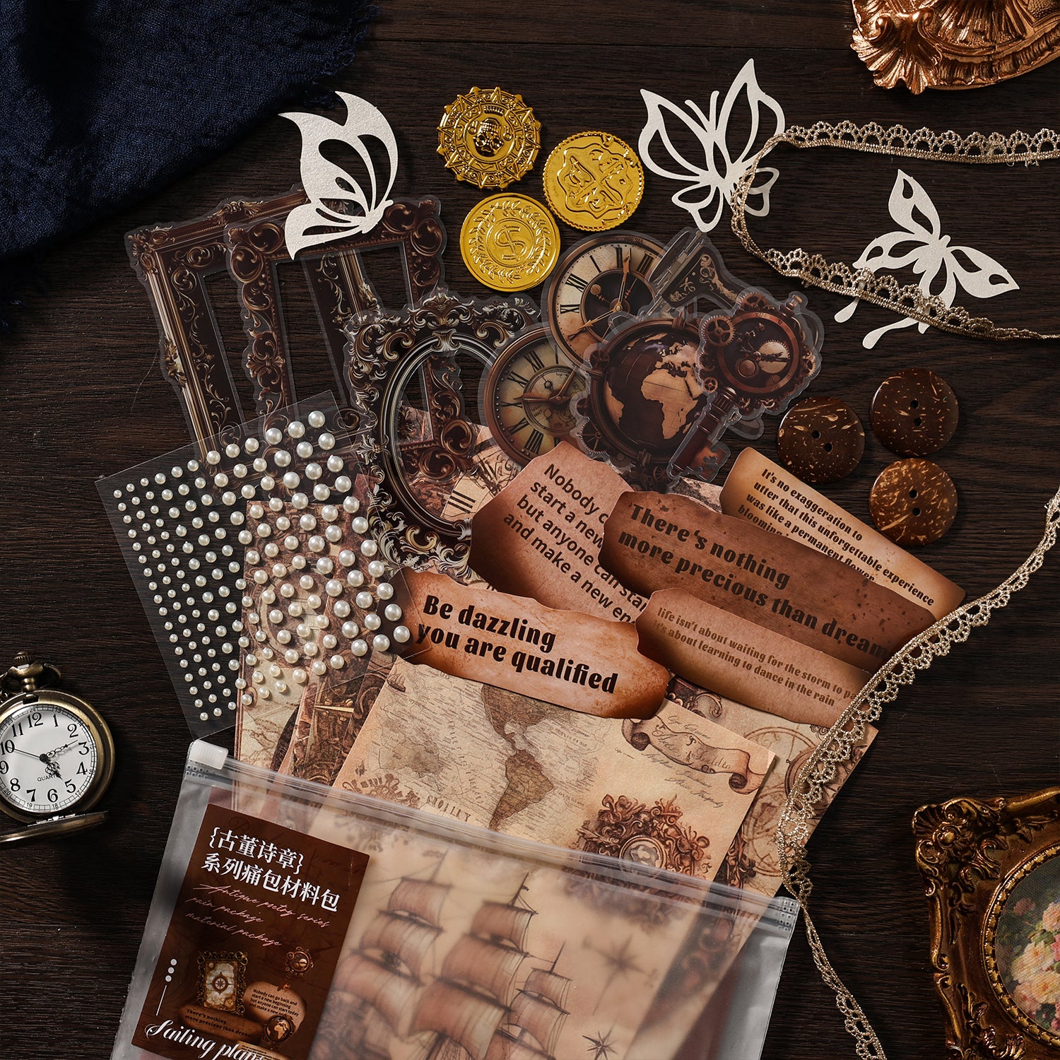 Vintage collage kit contents flat lay - antique frame and clock PET stickers, pearl sticker sheet, quote paper scrolls, lace trim and wood buttons